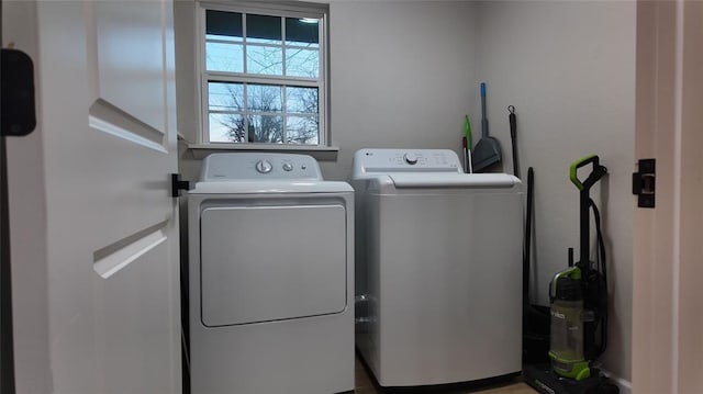 laundry area with separate washer and dryer