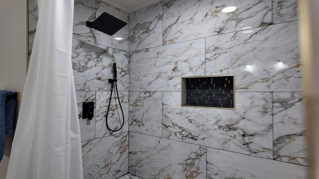 bathroom with walk in shower and crown molding