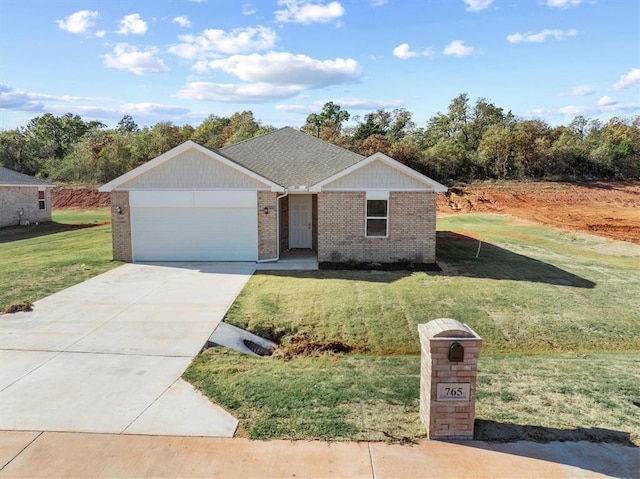 ranch-style house featuring a garage and a front lawn