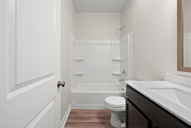 full bathroom featuring vanity,  shower combination, toilet, and wood-type flooring