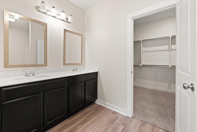 bathroom featuring hardwood / wood-style flooring and vanity