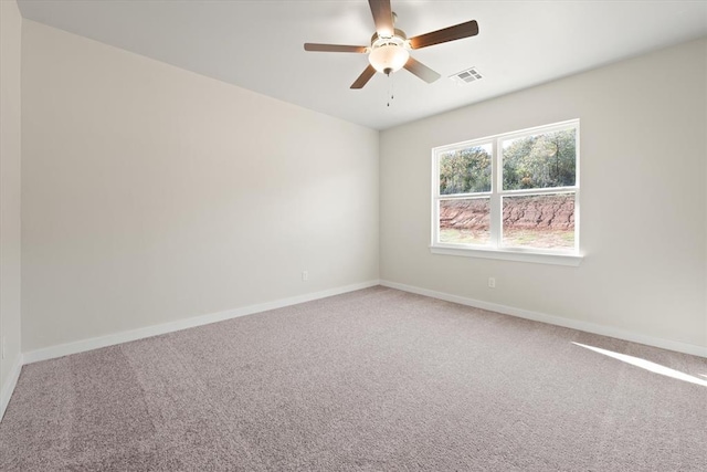 unfurnished room featuring carpet and ceiling fan