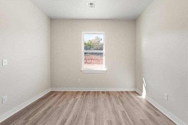 unfurnished room featuring light wood-type flooring