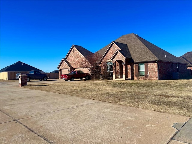 view of front of house with a front lawn and a garage