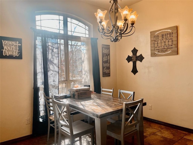 dining room with a notable chandelier