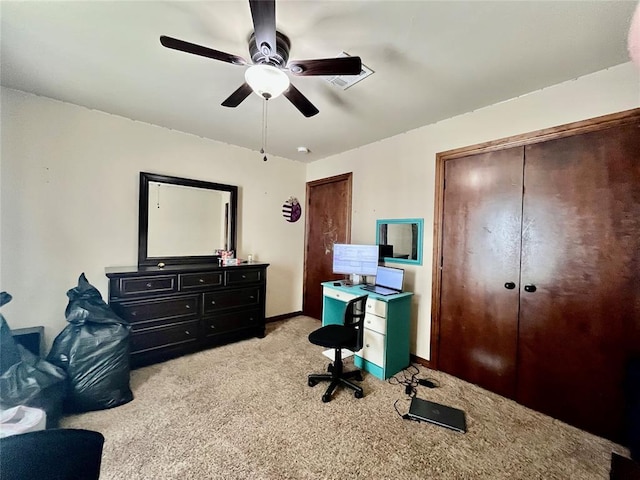 carpeted office with ceiling fan