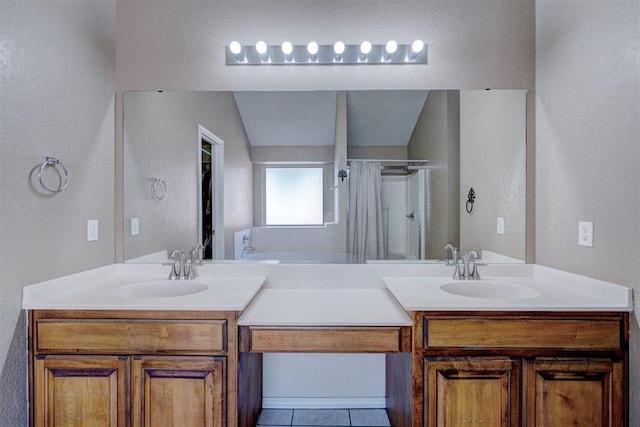 bathroom with a shower with shower curtain, vanity, and tile patterned floors