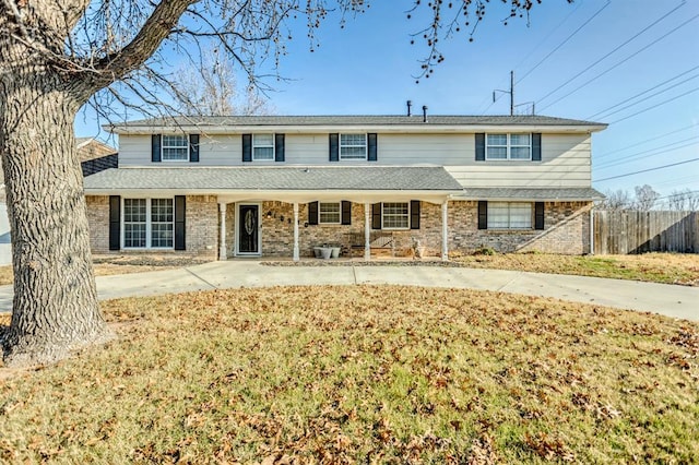 view of property with a front lawn