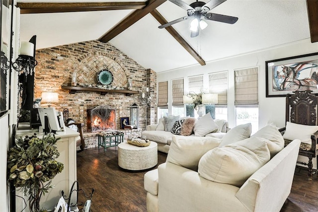 living room with a fireplace, dark wood-type flooring, ceiling fan, and vaulted ceiling with beams