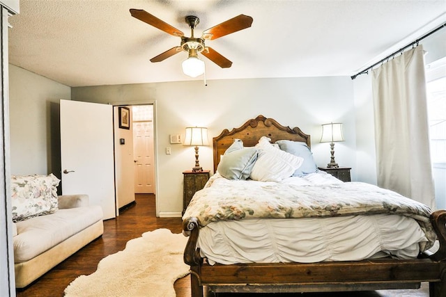 bedroom with dark wood-type flooring and ceiling fan