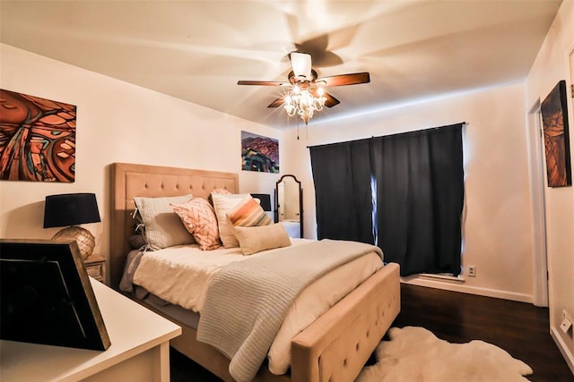 bedroom featuring dark wood-type flooring and ceiling fan