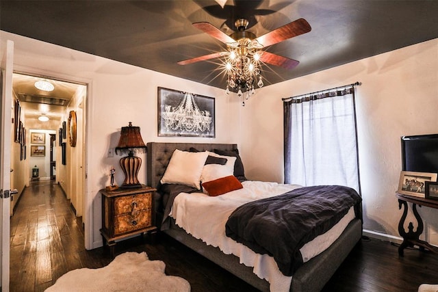 bedroom featuring ceiling fan and dark hardwood / wood-style flooring