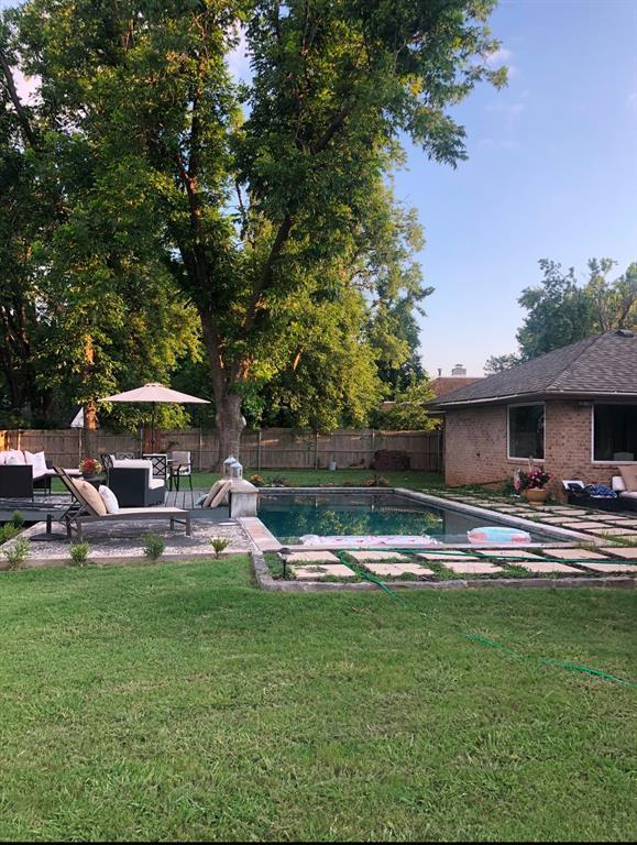 view of swimming pool with a lawn and an outdoor hangout area