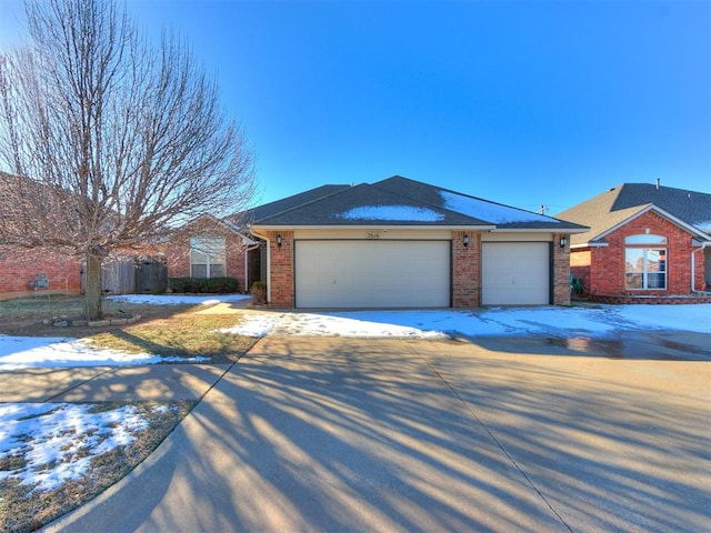 single story home featuring a garage