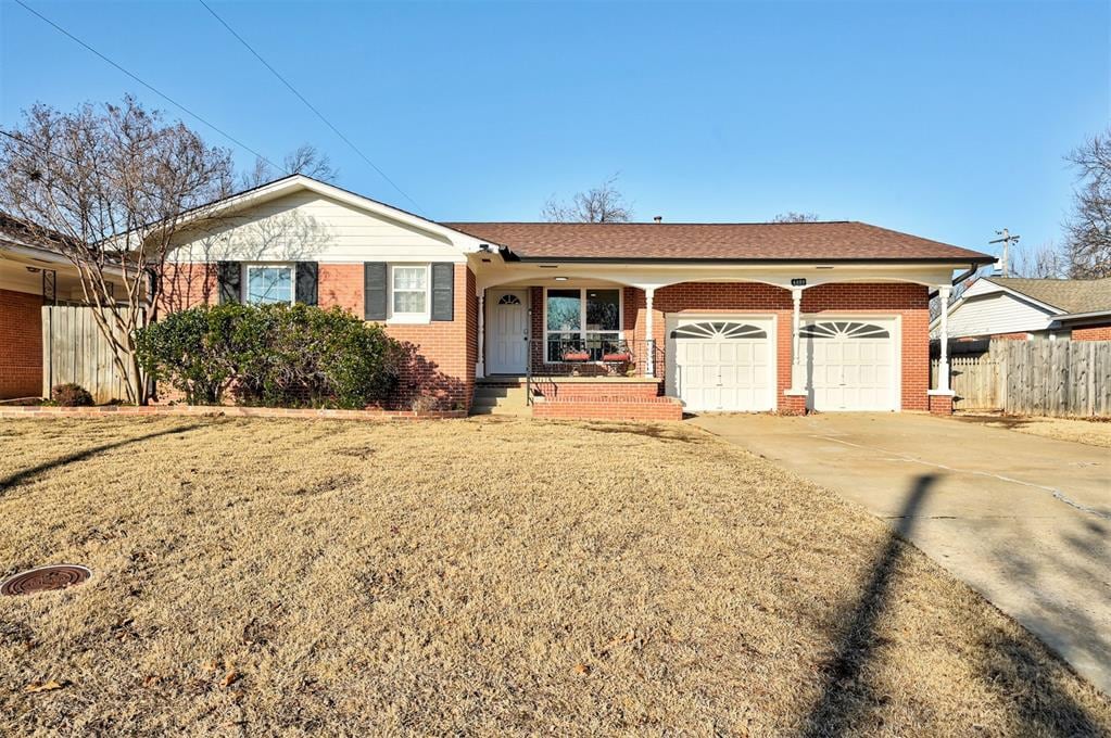 ranch-style house with a front lawn and a garage