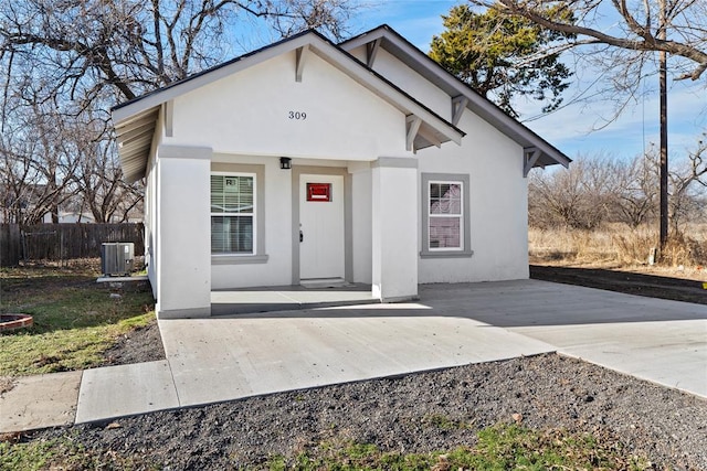 view of front of home featuring central air condition unit and a porch