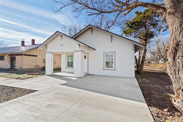 single story home featuring a patio