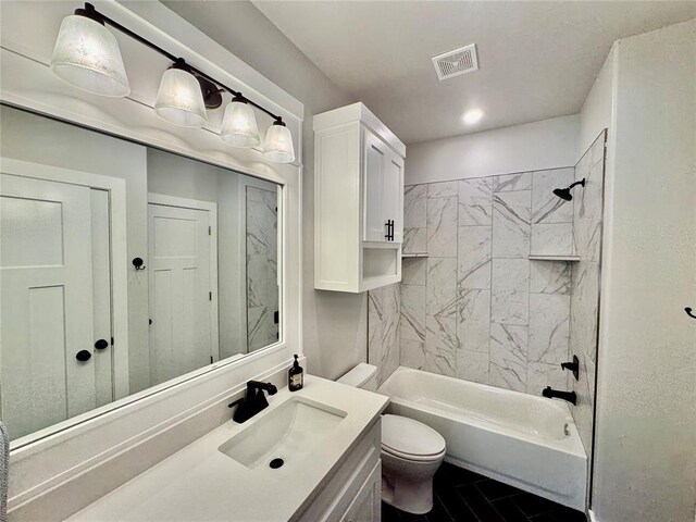 full bathroom with toilet, tiled shower / bath combo, and vanity