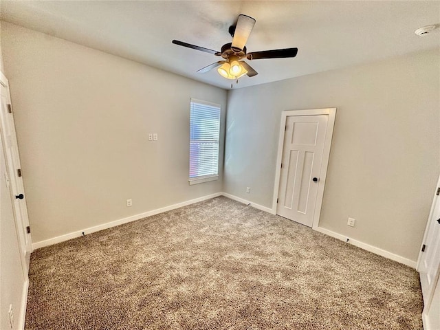 unfurnished bedroom featuring ceiling fan, a closet, and carpet floors