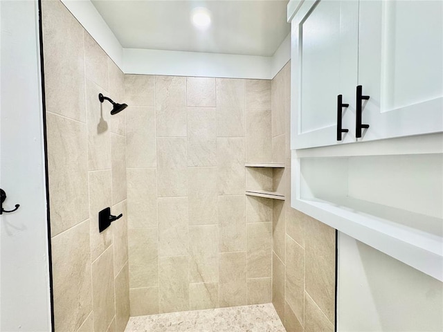 bathroom with a tile shower