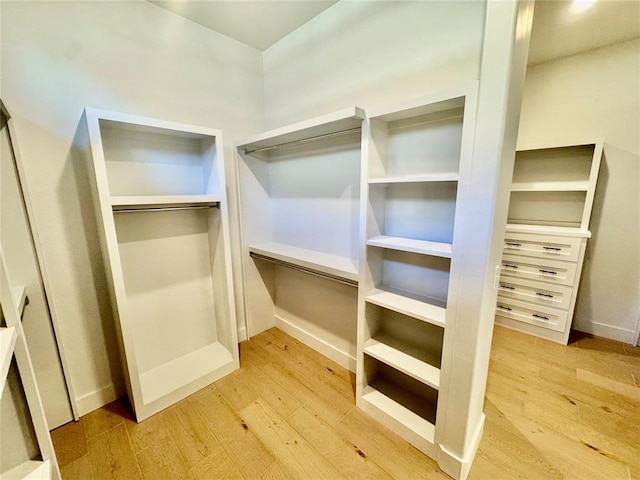 walk in closet featuring light hardwood / wood-style floors