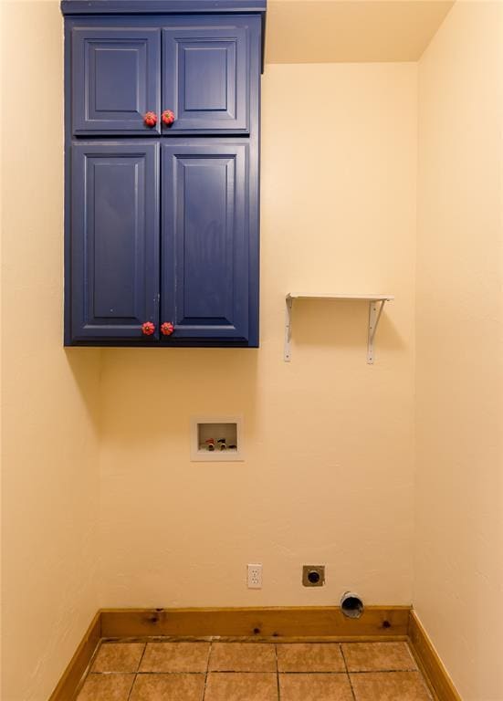 clothes washing area featuring hookup for a washing machine, baseboards, cabinet space, tile patterned floors, and electric dryer hookup