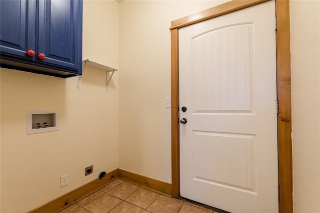 laundry room featuring cabinet space, light tile patterned floors, baseboards, hookup for a washing machine, and electric dryer hookup