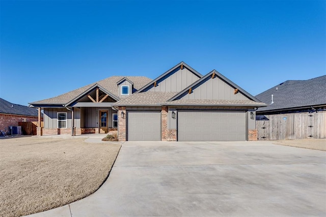 view of front of home featuring a garage and central AC unit