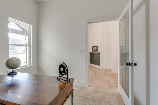 office space featuring french doors and light parquet floors