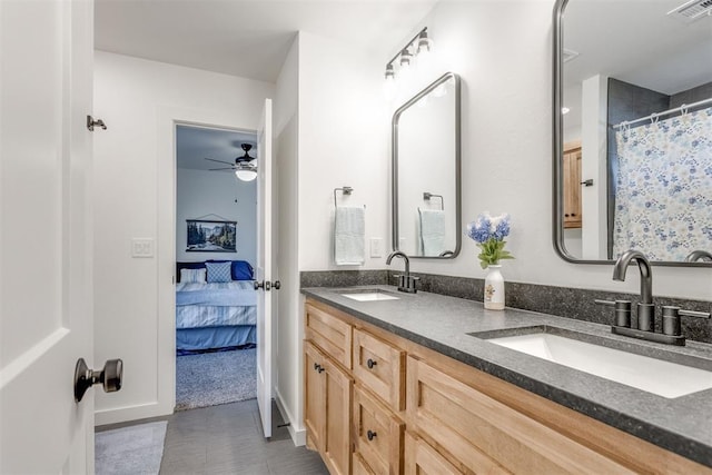 bathroom with tile patterned floors, ceiling fan, and vanity