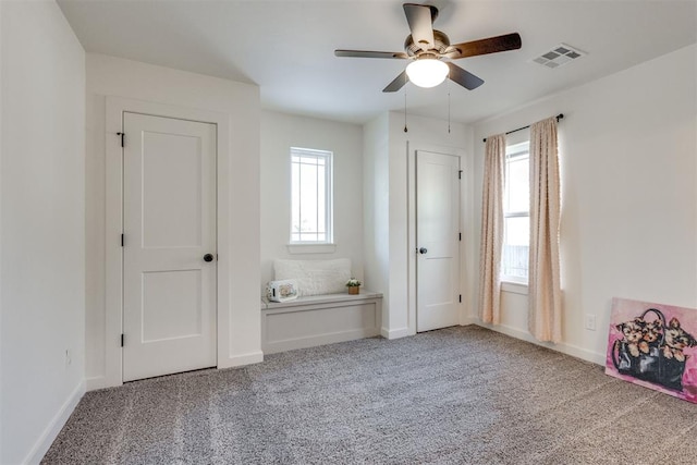 unfurnished bedroom with carpet and ceiling fan