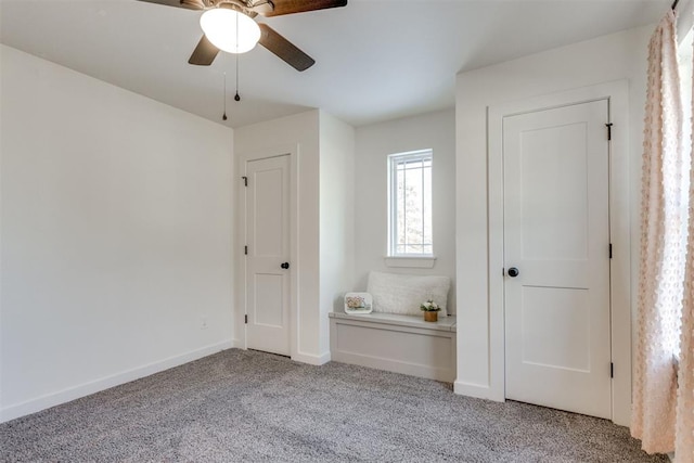 unfurnished bedroom featuring ceiling fan and light carpet