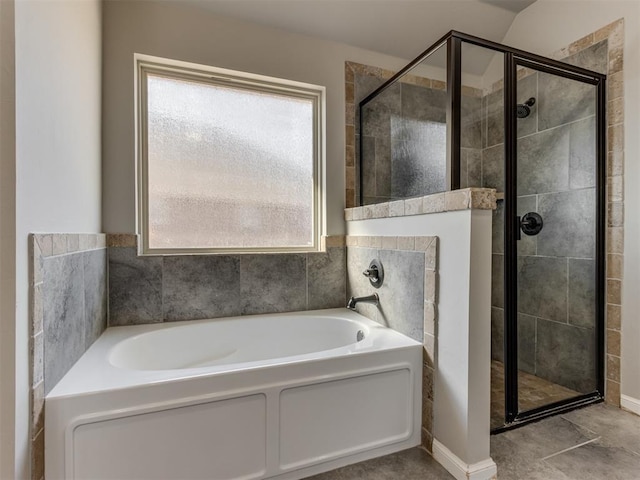 bathroom featuring tile patterned flooring and independent shower and bath