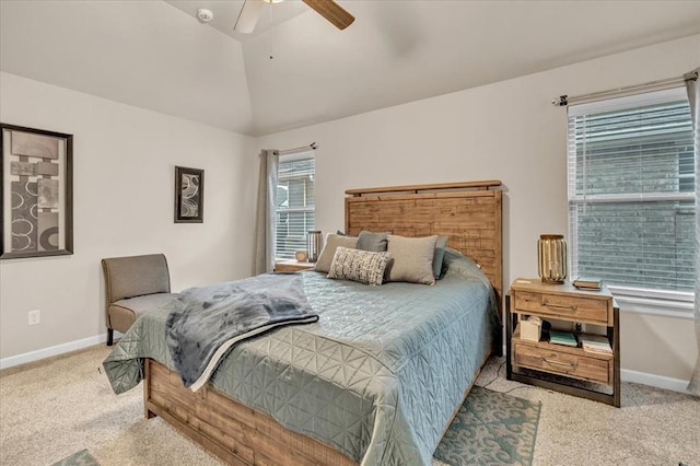 bedroom featuring ceiling fan, light colored carpet, and lofted ceiling