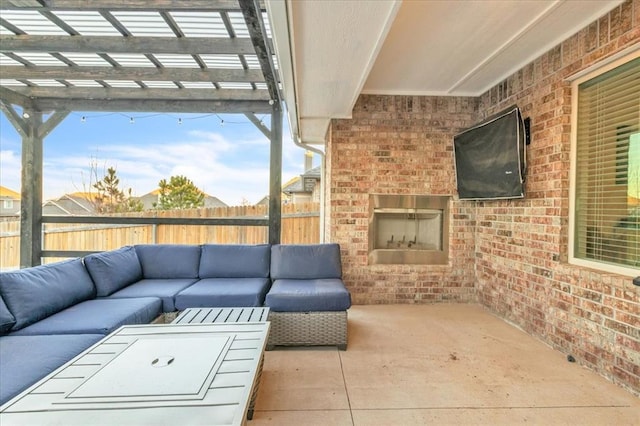 view of patio featuring an outdoor living space with a fireplace and a pergola