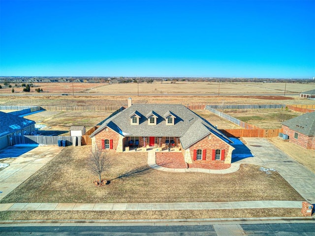 view of front facade with a rural view