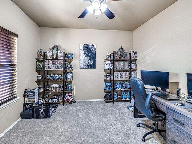 office area featuring carpet flooring, baseboards, and ceiling fan