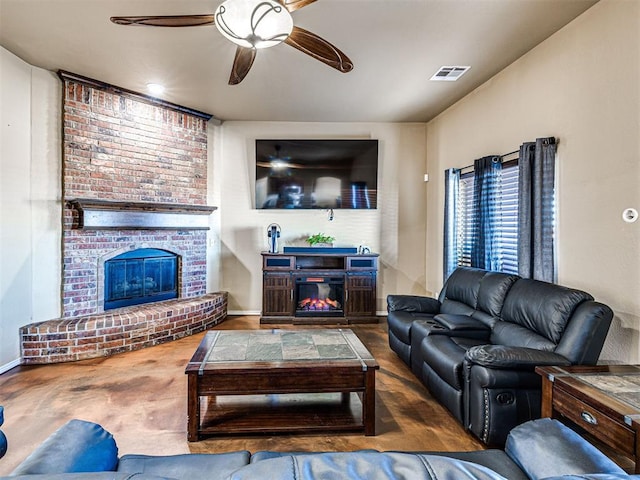 living area with a brick fireplace, a ceiling fan, visible vents, and baseboards