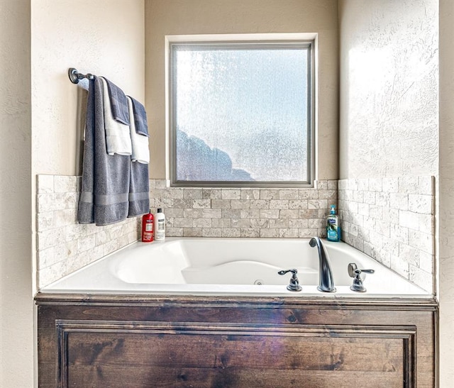 full bathroom with a jetted tub