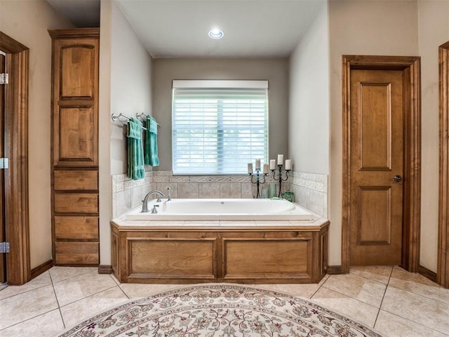 bathroom featuring tile patterned flooring and a bathtub