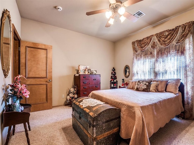 bedroom featuring ceiling fan and light carpet