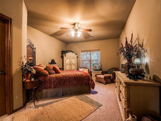 bedroom featuring light carpet and ceiling fan