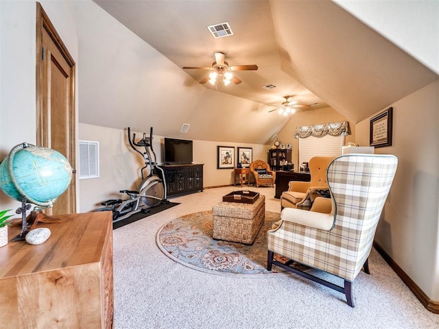 living area featuring carpet floors, vaulted ceiling, and ceiling fan