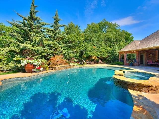 view of pool featuring an in ground hot tub and a patio