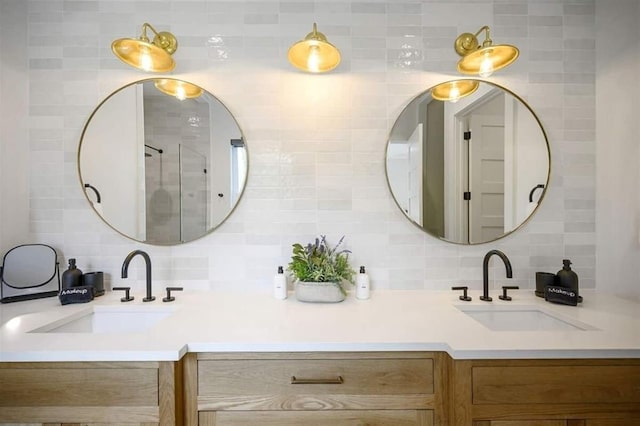 bathroom with tasteful backsplash and vanity