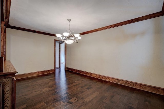 unfurnished dining area featuring dark hardwood / wood-style flooring, crown molding, and a chandelier