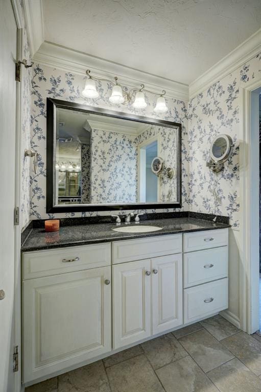 bathroom featuring vanity and ornamental molding