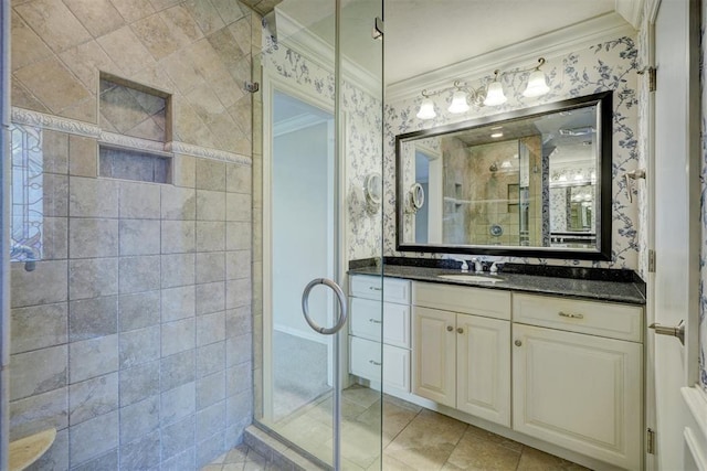 bathroom with tile patterned floors, an enclosed shower, vanity, and crown molding