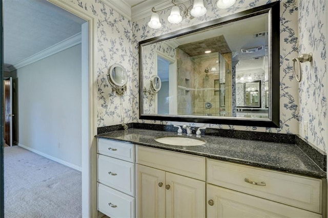 bathroom featuring an enclosed shower, vanity, and crown molding