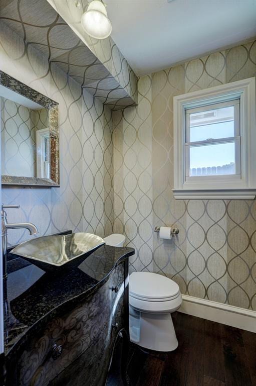 bathroom featuring toilet and hardwood / wood-style floors